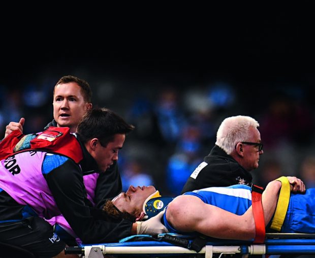 Kangaroos star forward Ben Brown is treated for concussion during an AFL match in 2017. PICTURE: FAIRFAX/AAP/JULIAN SMITH