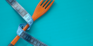 Measuring tape wrapped around a fork
